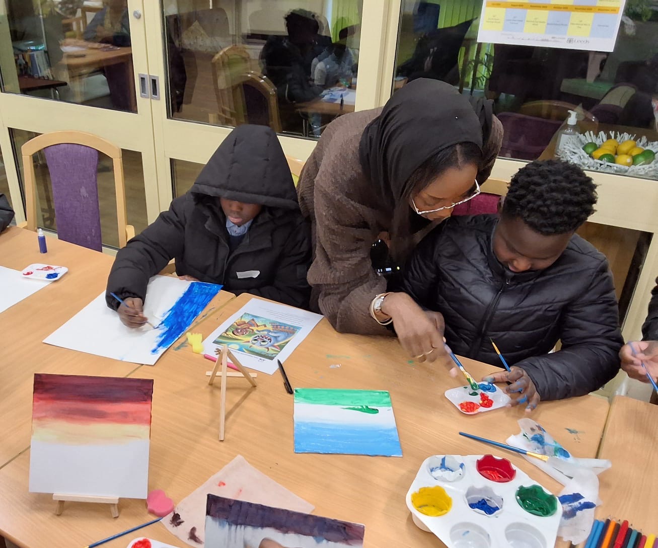 Children painting during an arts workshop
